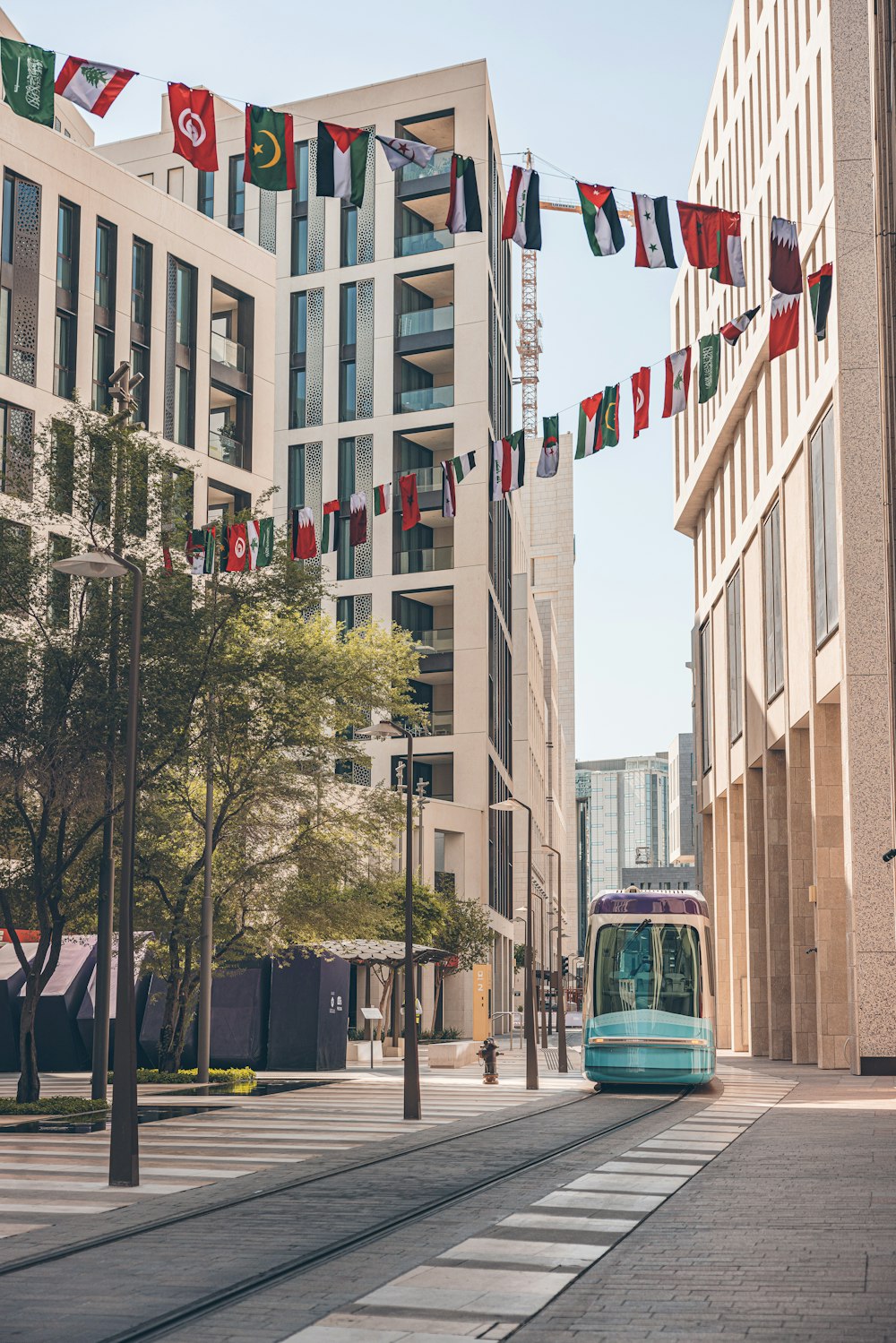 a trolley on a city street with buildings in the background