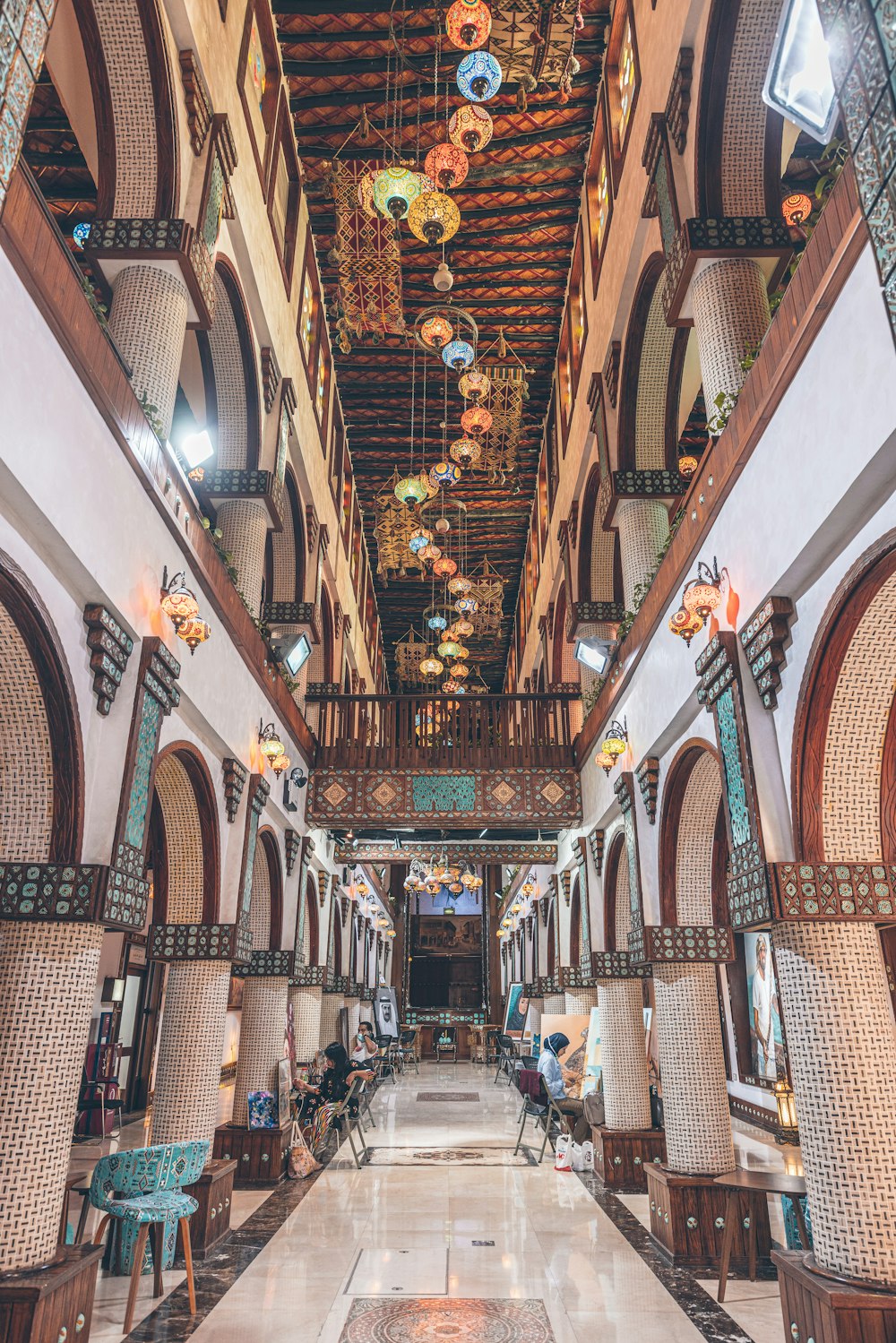 a large building with a bunch of lights hanging from the ceiling