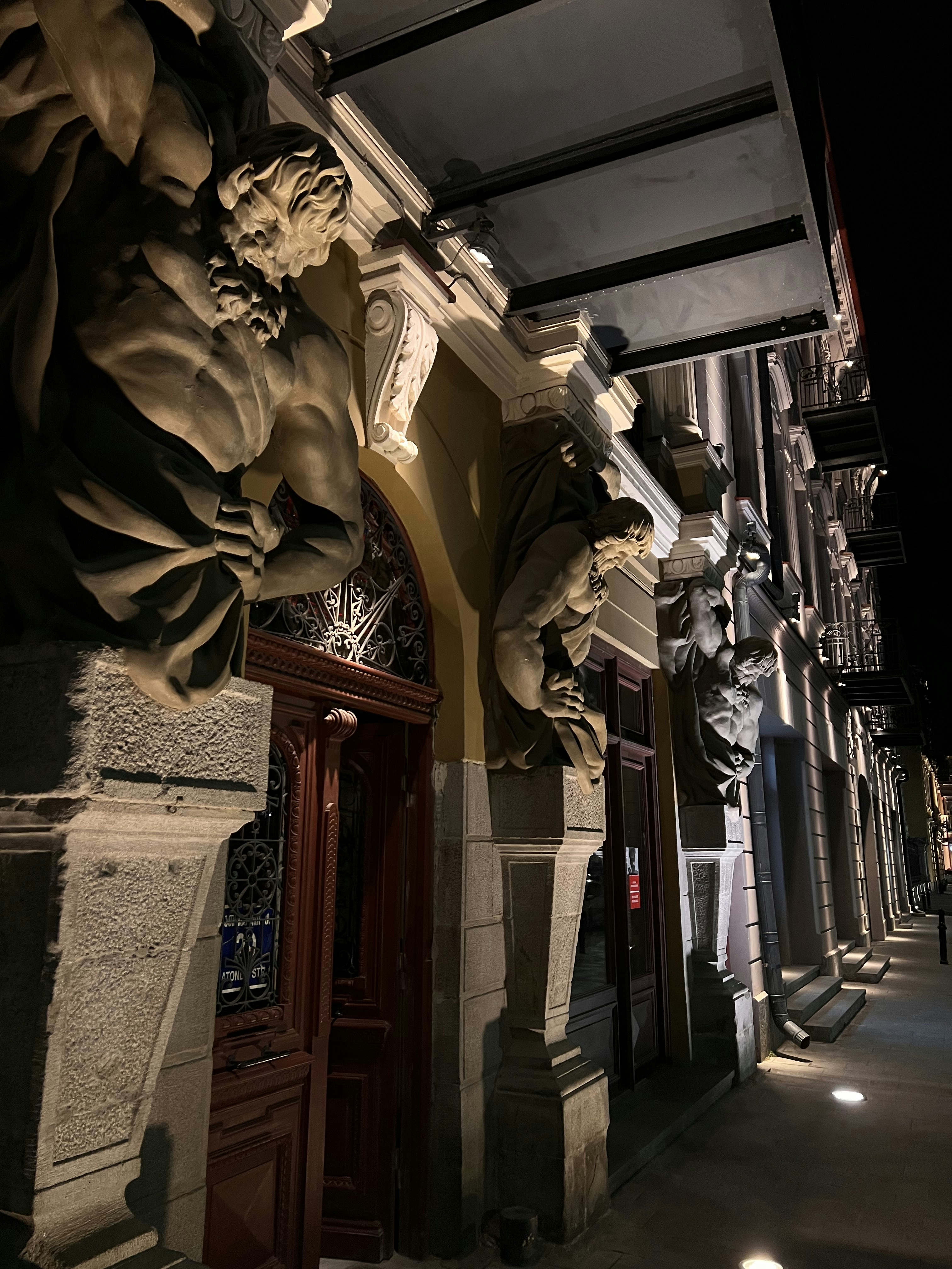 a building with statues on the outside of it