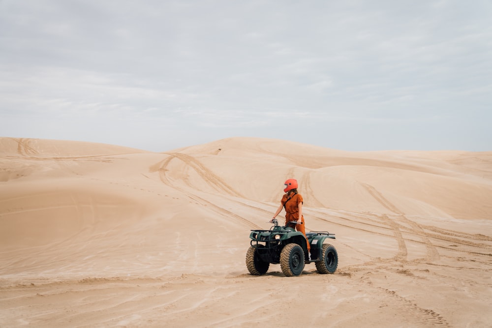 a person riding a four wheeler in the desert