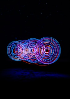 a blurry photo of a group of circles in the dark