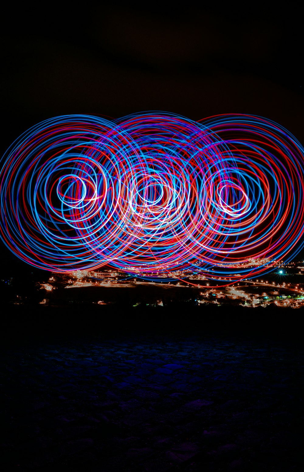 a group of circles of light in the dark