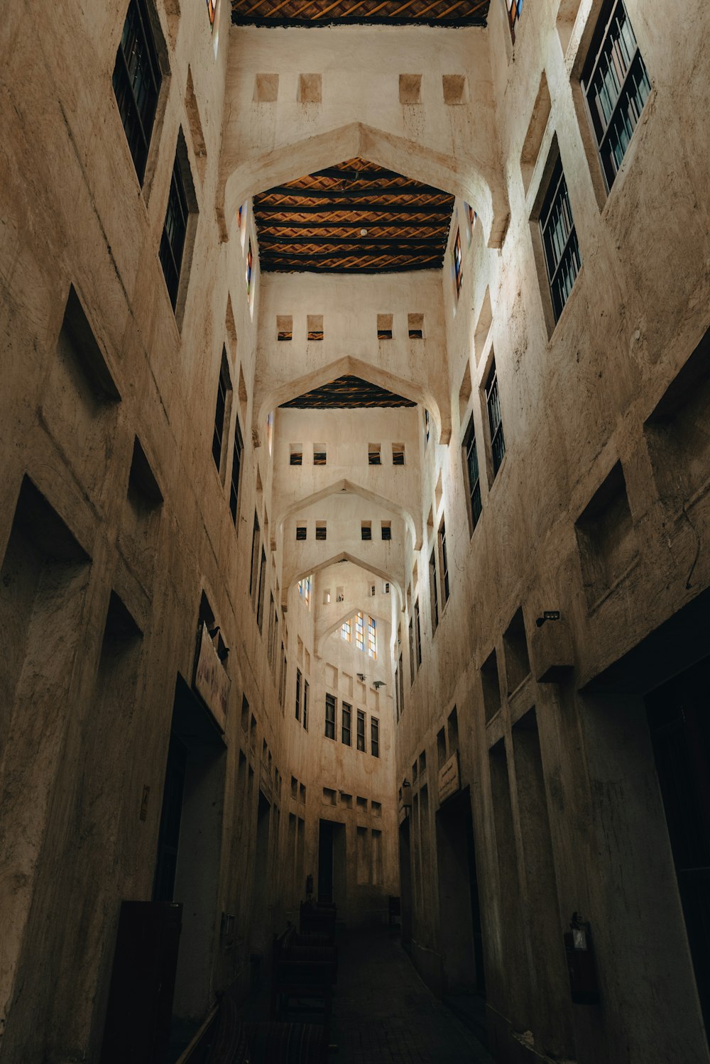 a very long building with some windows and a ceiling