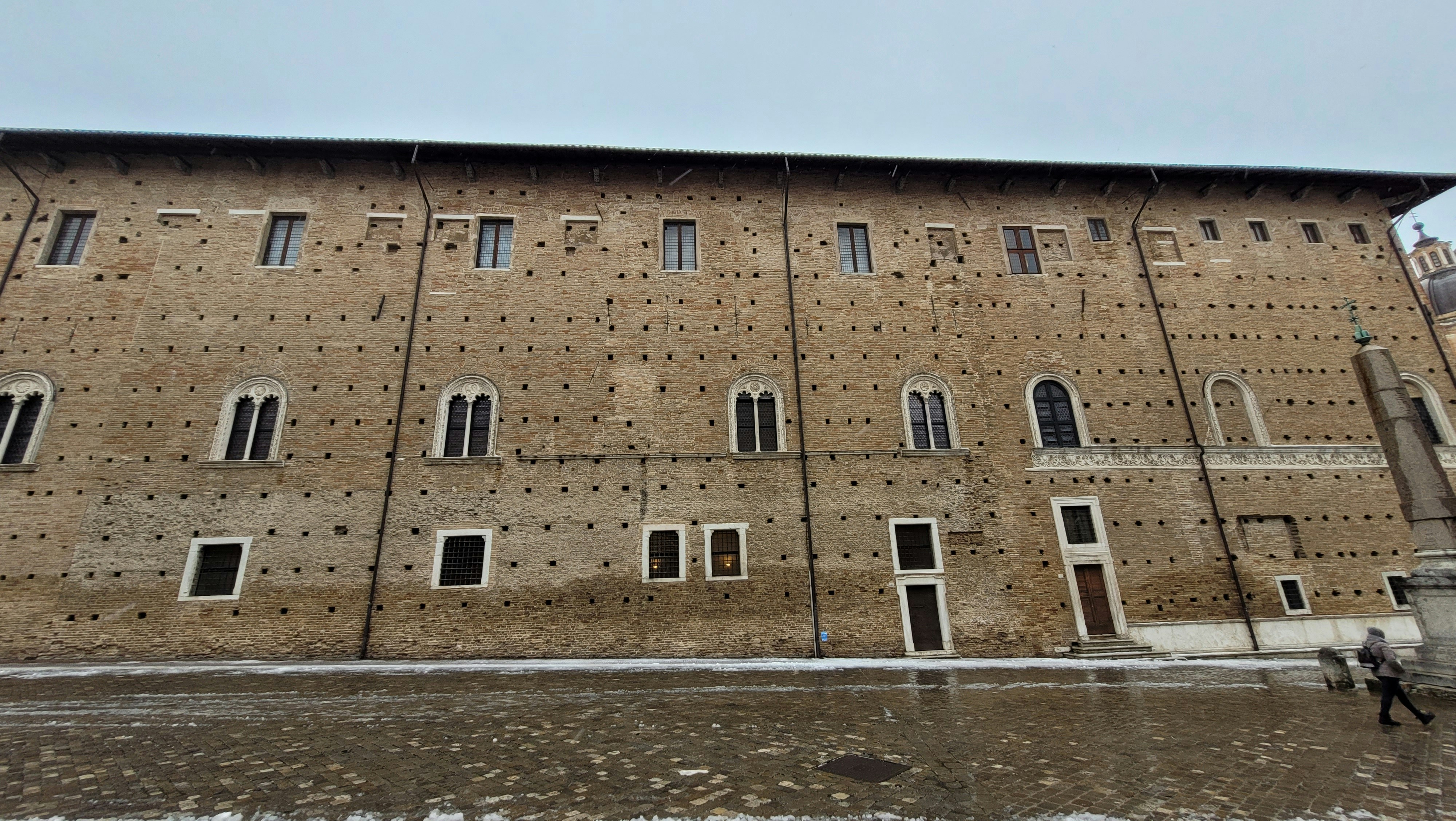 a tall brick building with many windows