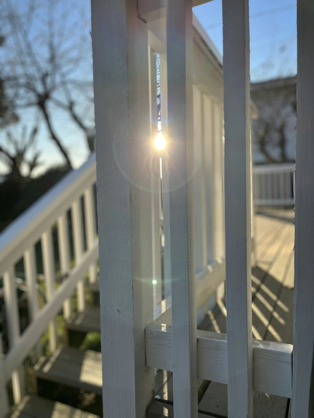 a close up of a light on a porch