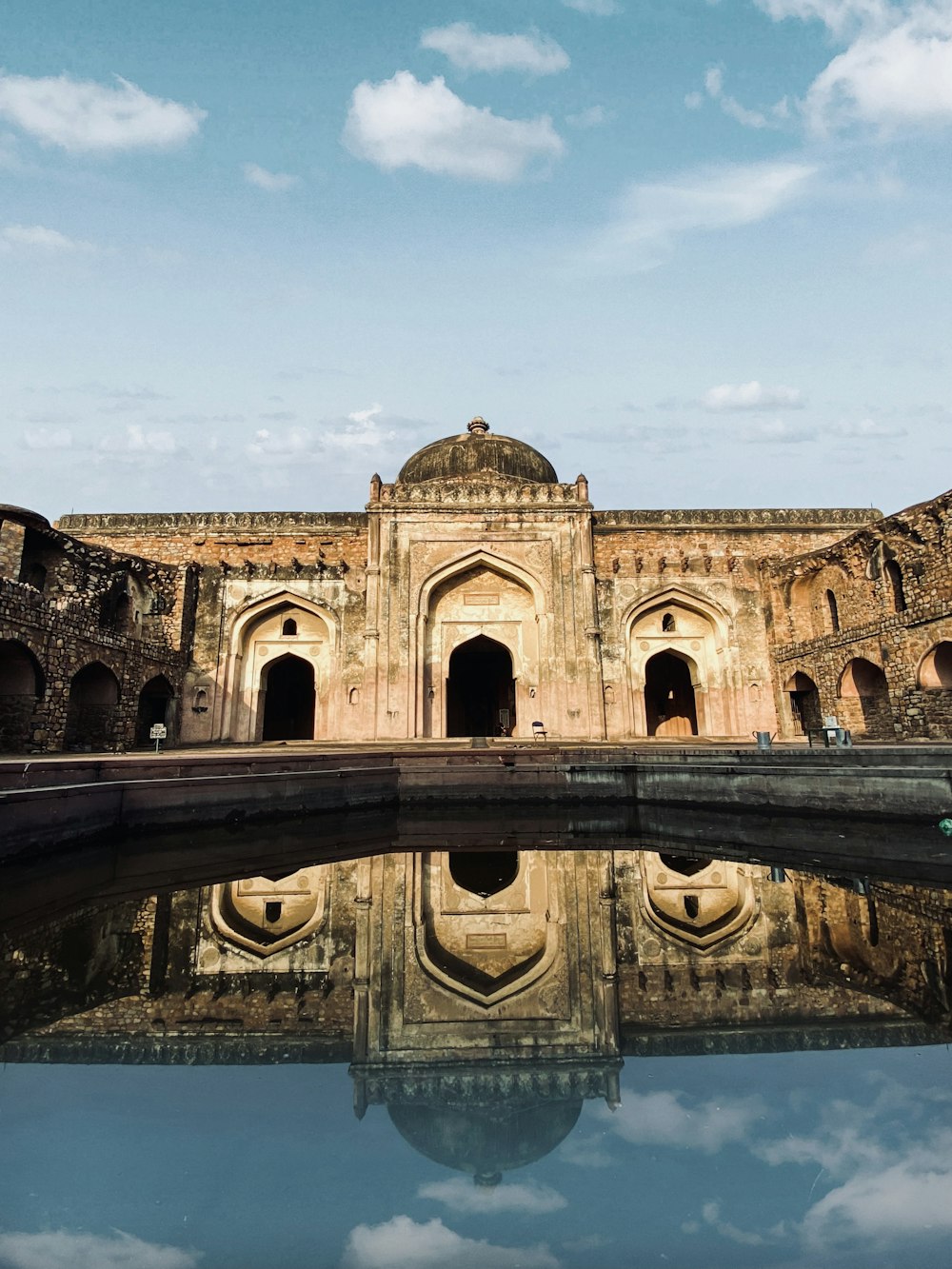 a reflection of a building in the water