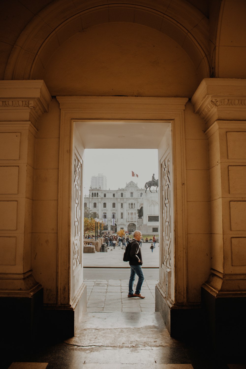 a person standing in a doorway of a building