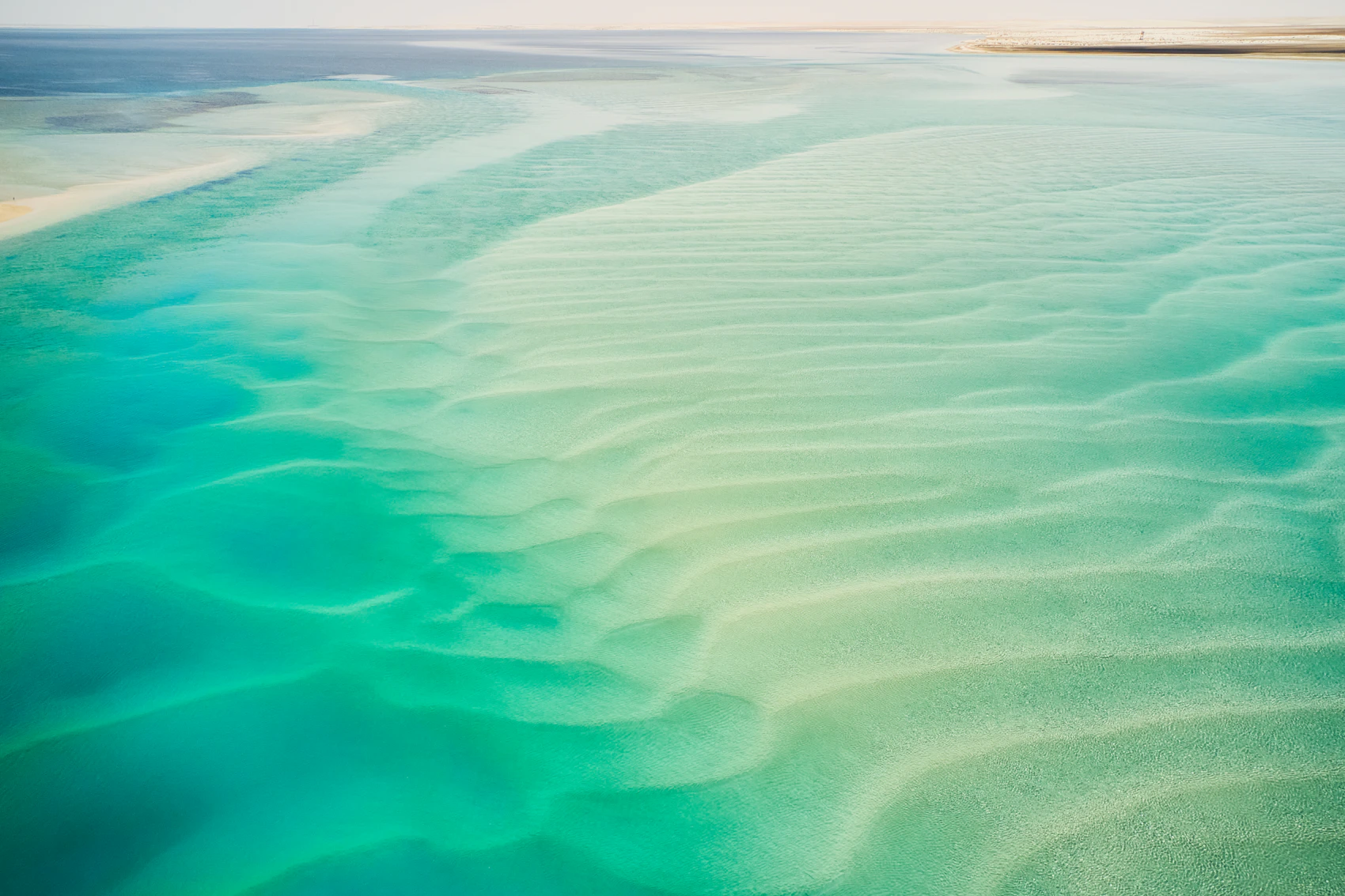 Turquoise shallows and pale sand at Qatar’s Inland Sea