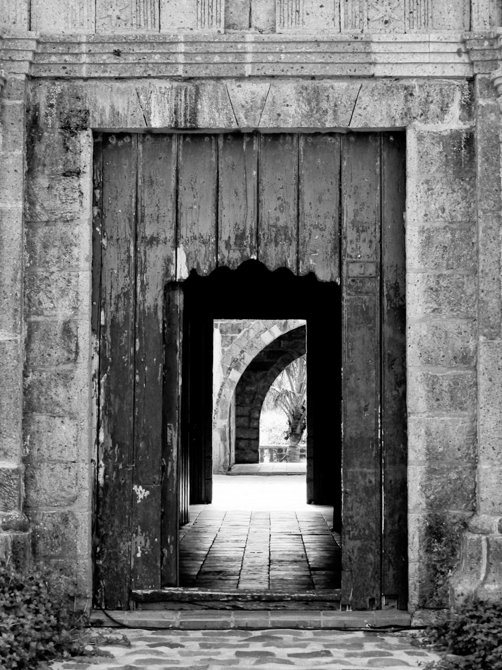 a black and white photo of a doorway