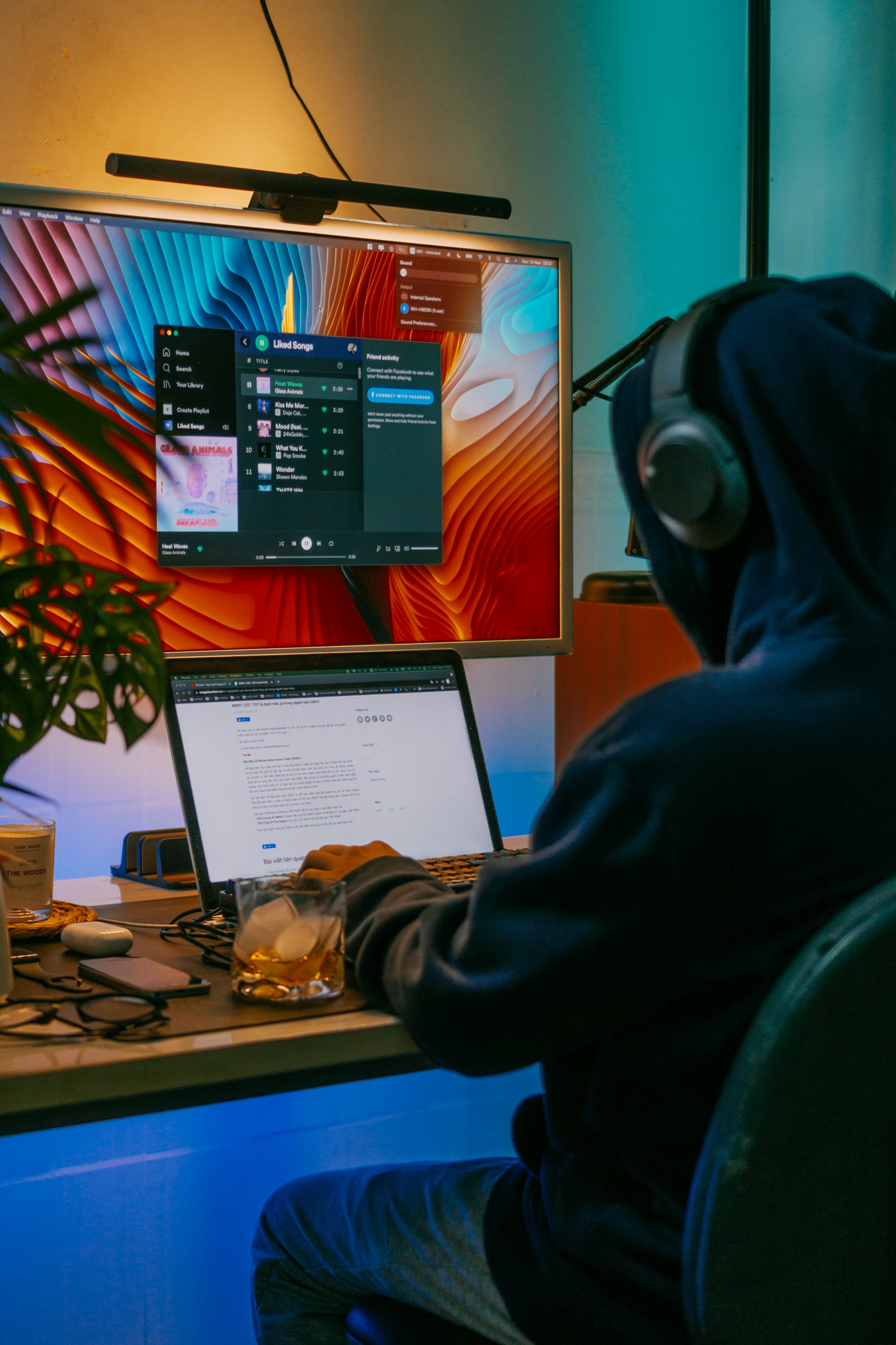 a man sitting at a desk in front of a computer