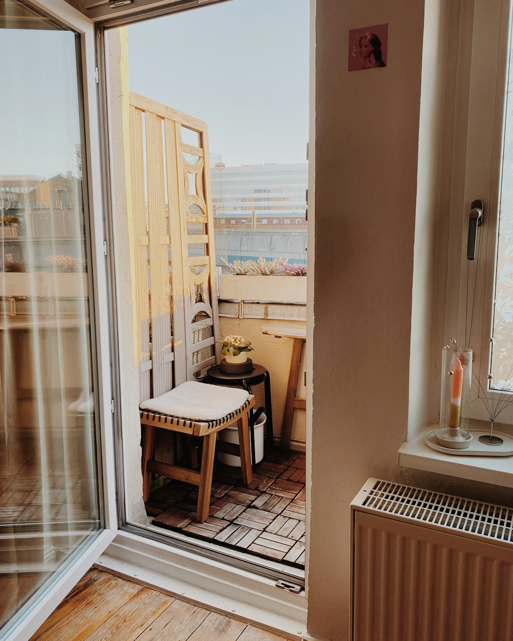 a small balcony with a table and chairs