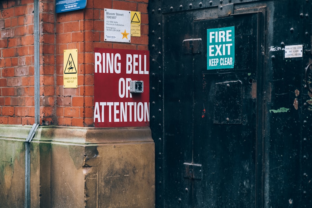 a fire exit sign on the side of a building