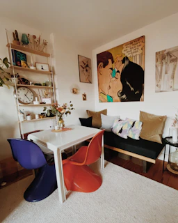 a living room filled with furniture and a white table