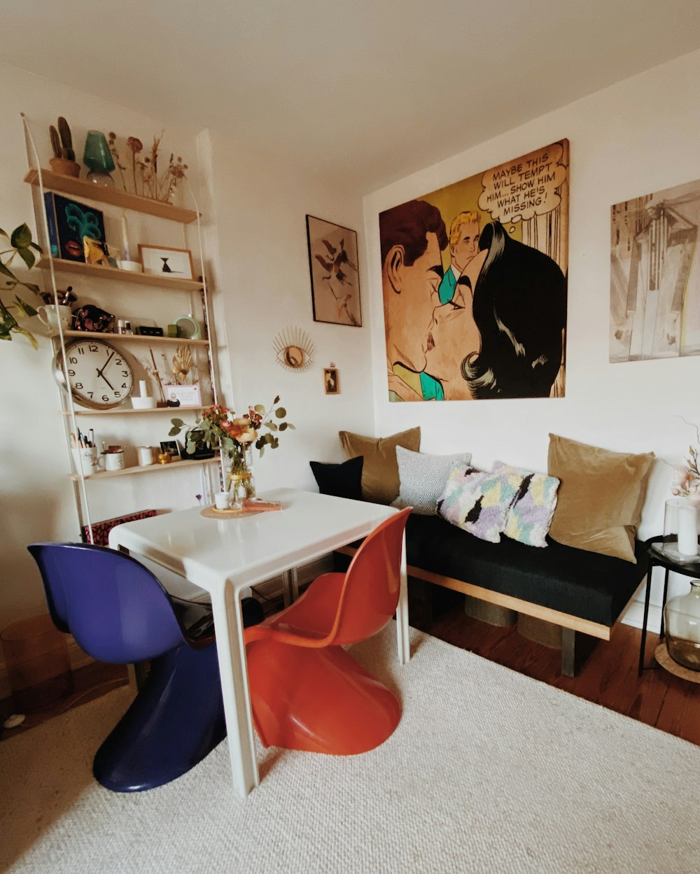 a living room filled with furniture and a white table