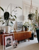 Mid-century teak sideboard with clean lines and rich wood grain in a cozy living room.