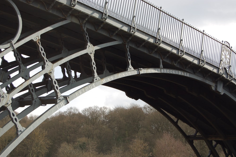 a bridge that has a bunch of metal railings on it