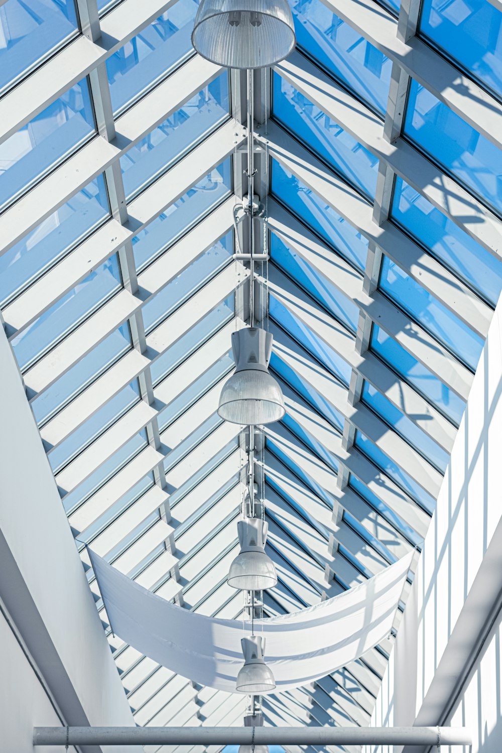 the ceiling of a building with a glass roof