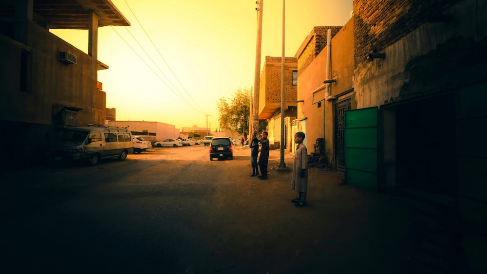 a couple of people that are standing in the street