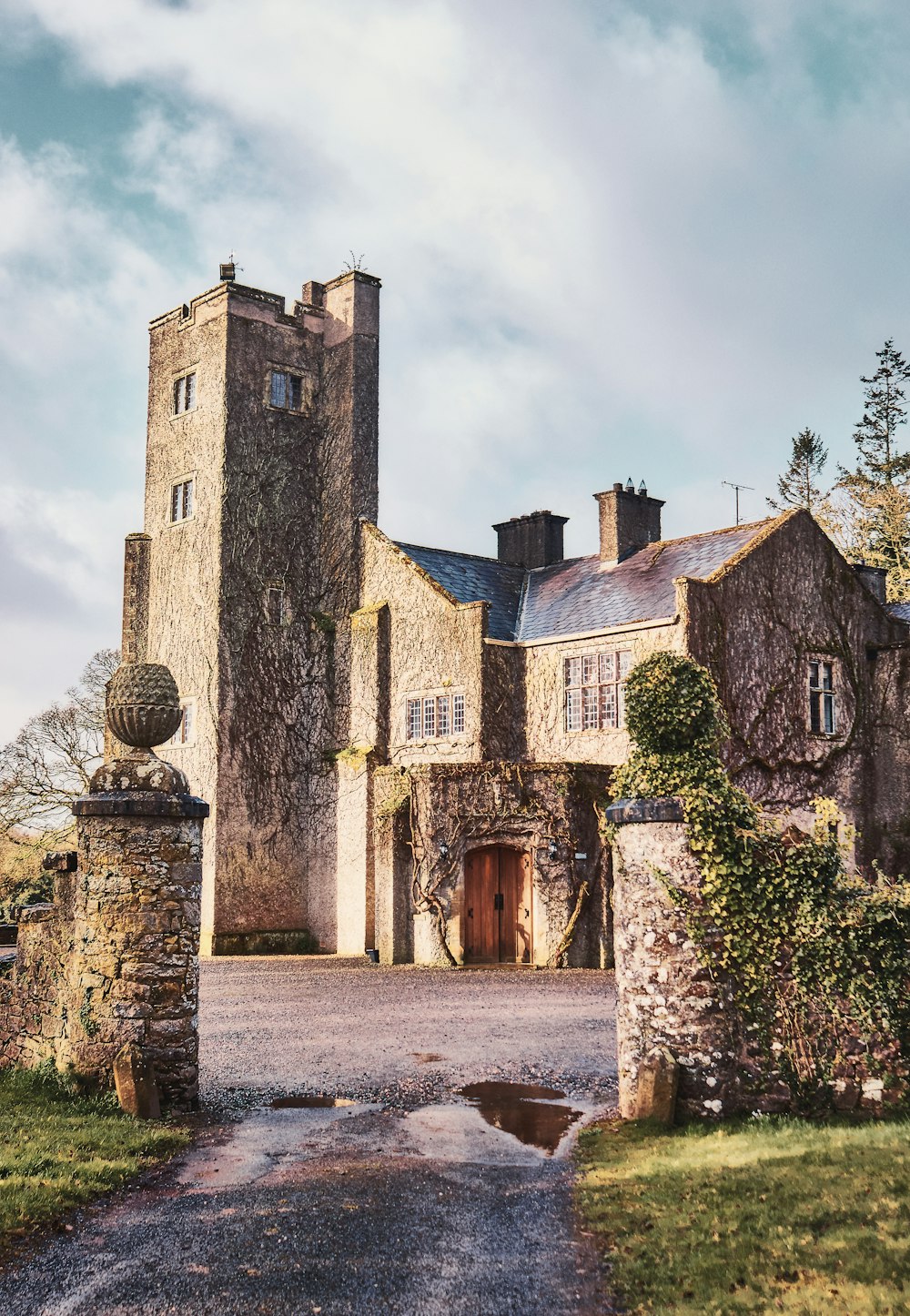 a large building with a tower and a gate