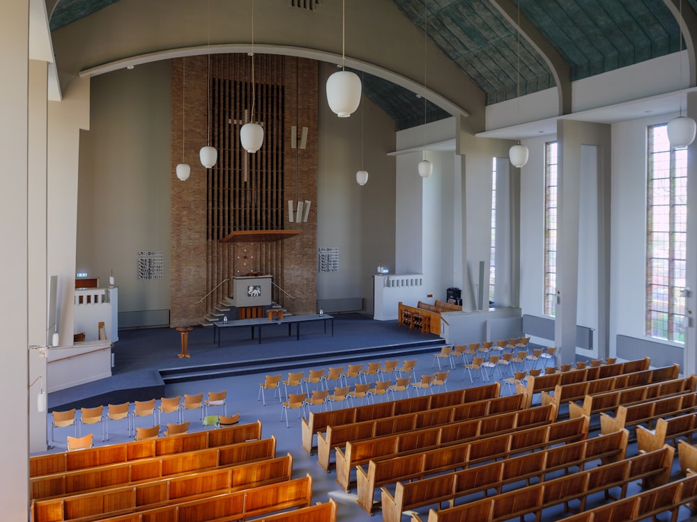 a church with rows of wooden pews