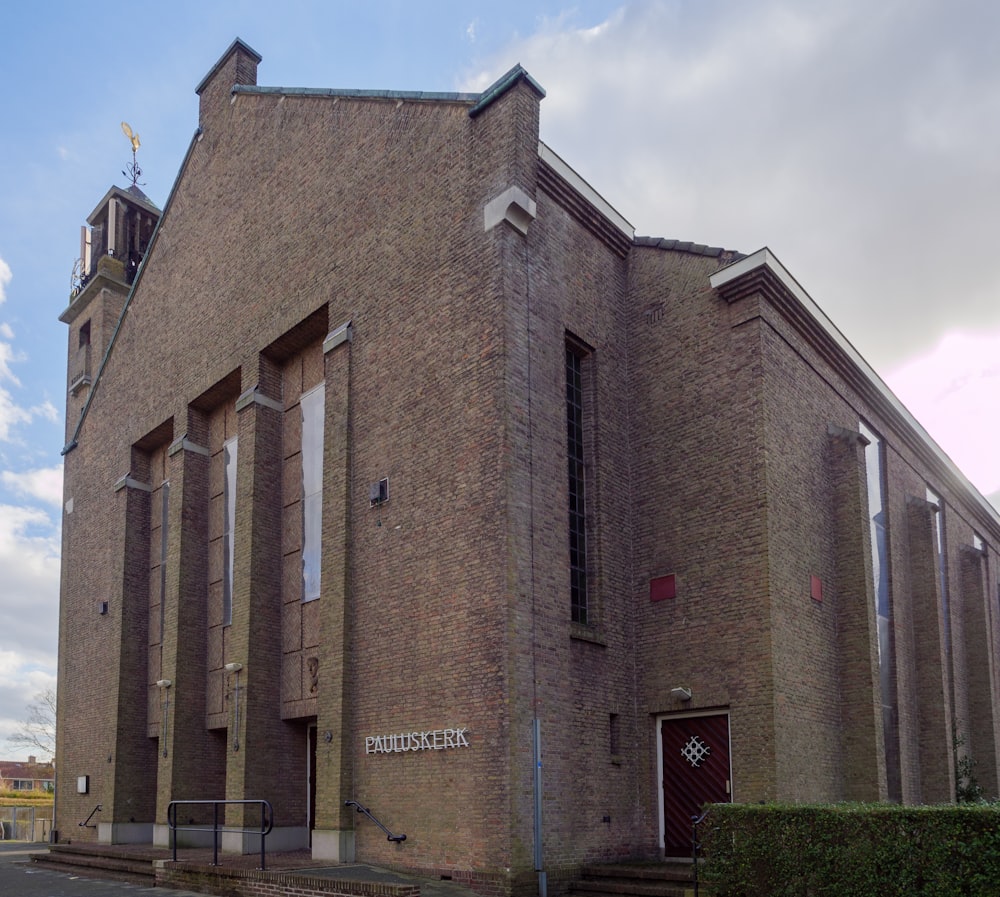 a large brick building with a clock tower on top of it