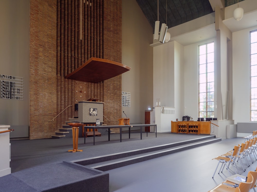 a church with a stage and chairs in front of it