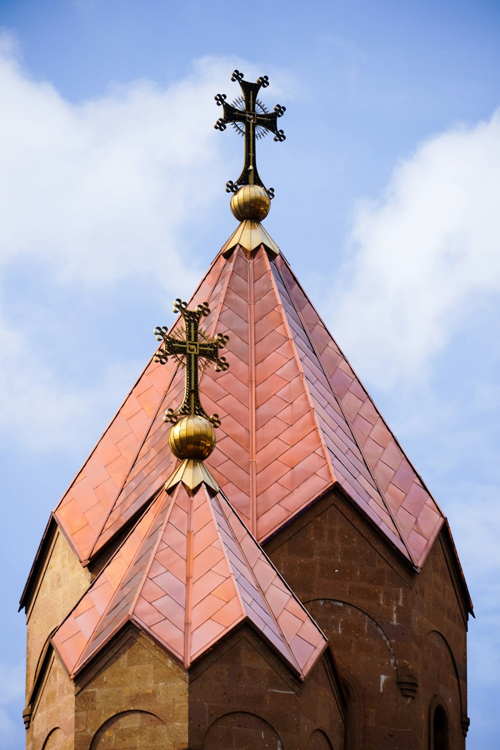 a church steeple with a cross on top