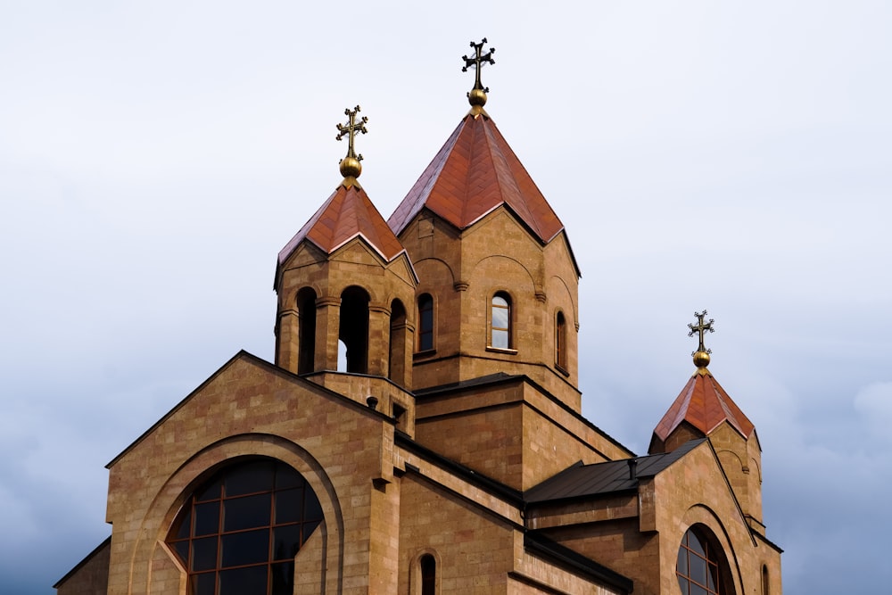 a church steeple with two crosses on top