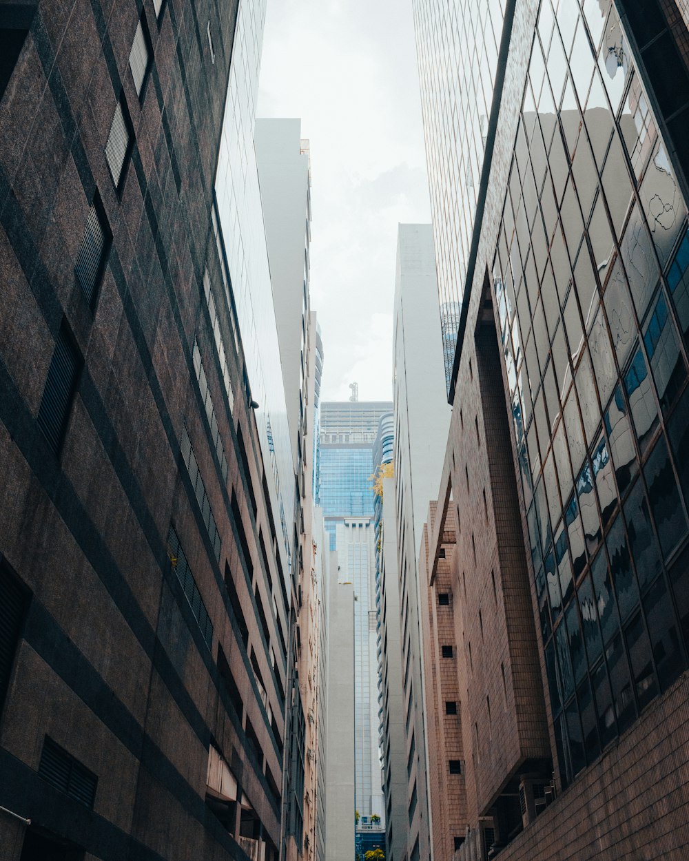 a narrow city street lined with tall buildings