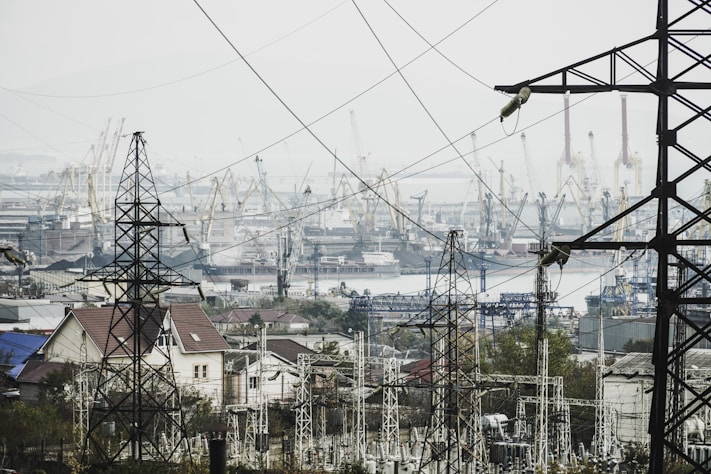 a view of a city with lots of power lines