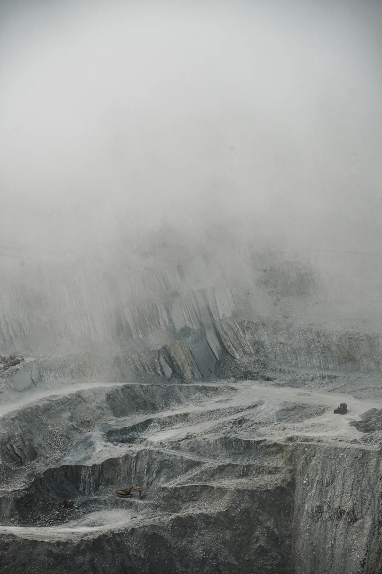 a man standing on top of a snow covered mountain