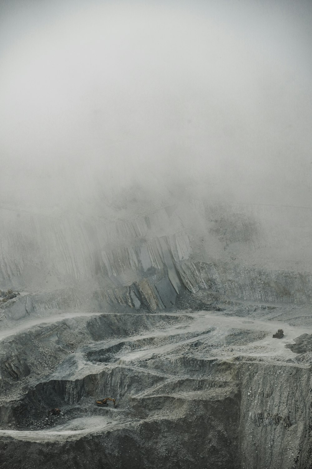 a man standing on top of a snow covered mountain