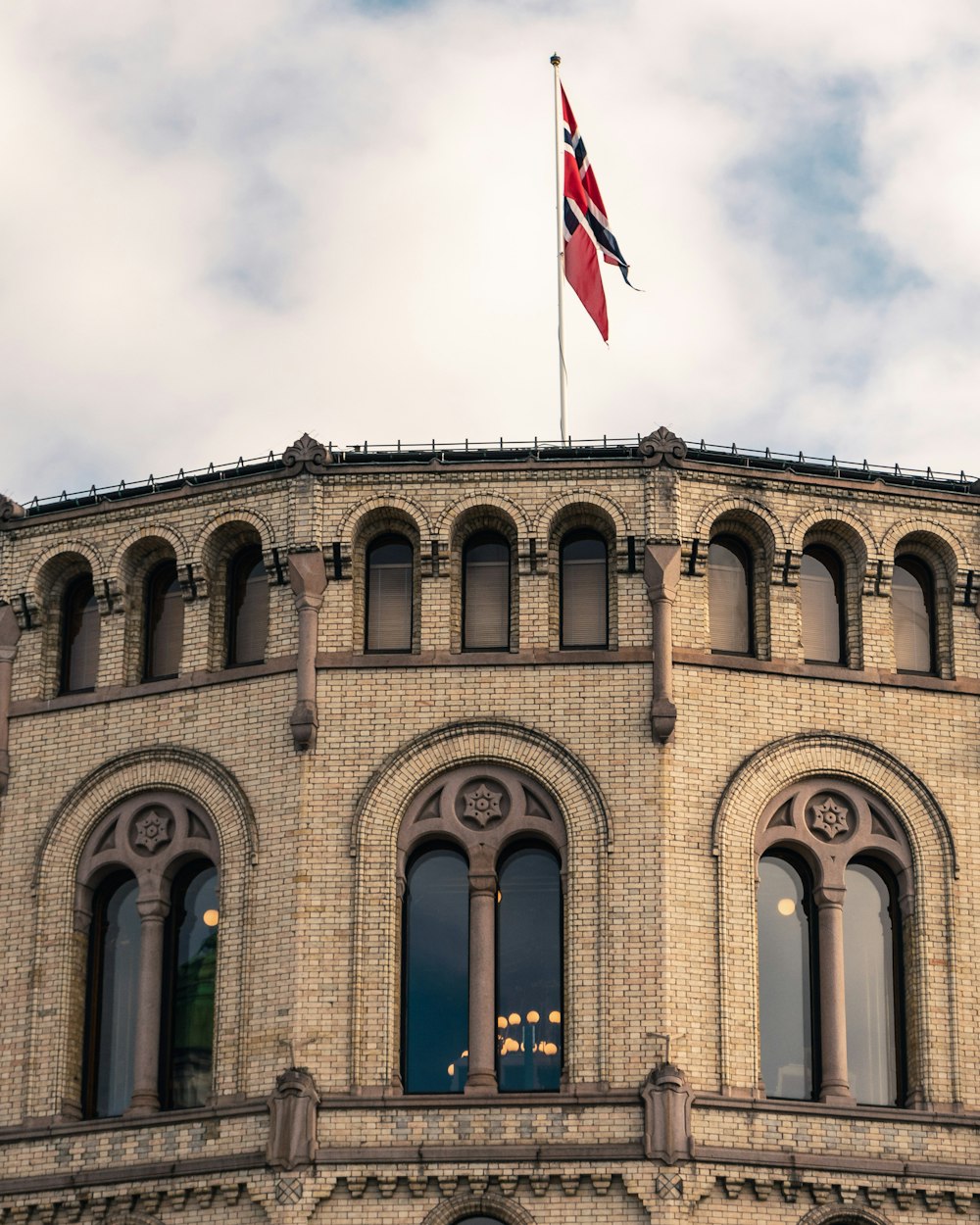 a large building with a flag on top of it