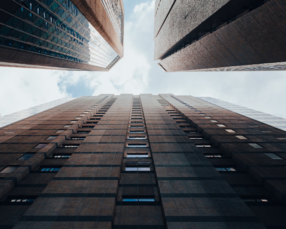 looking up at tall buildings in a city