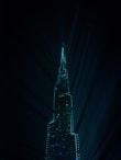 a very tall building lit up at night