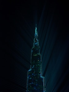 a very tall building lit up at night