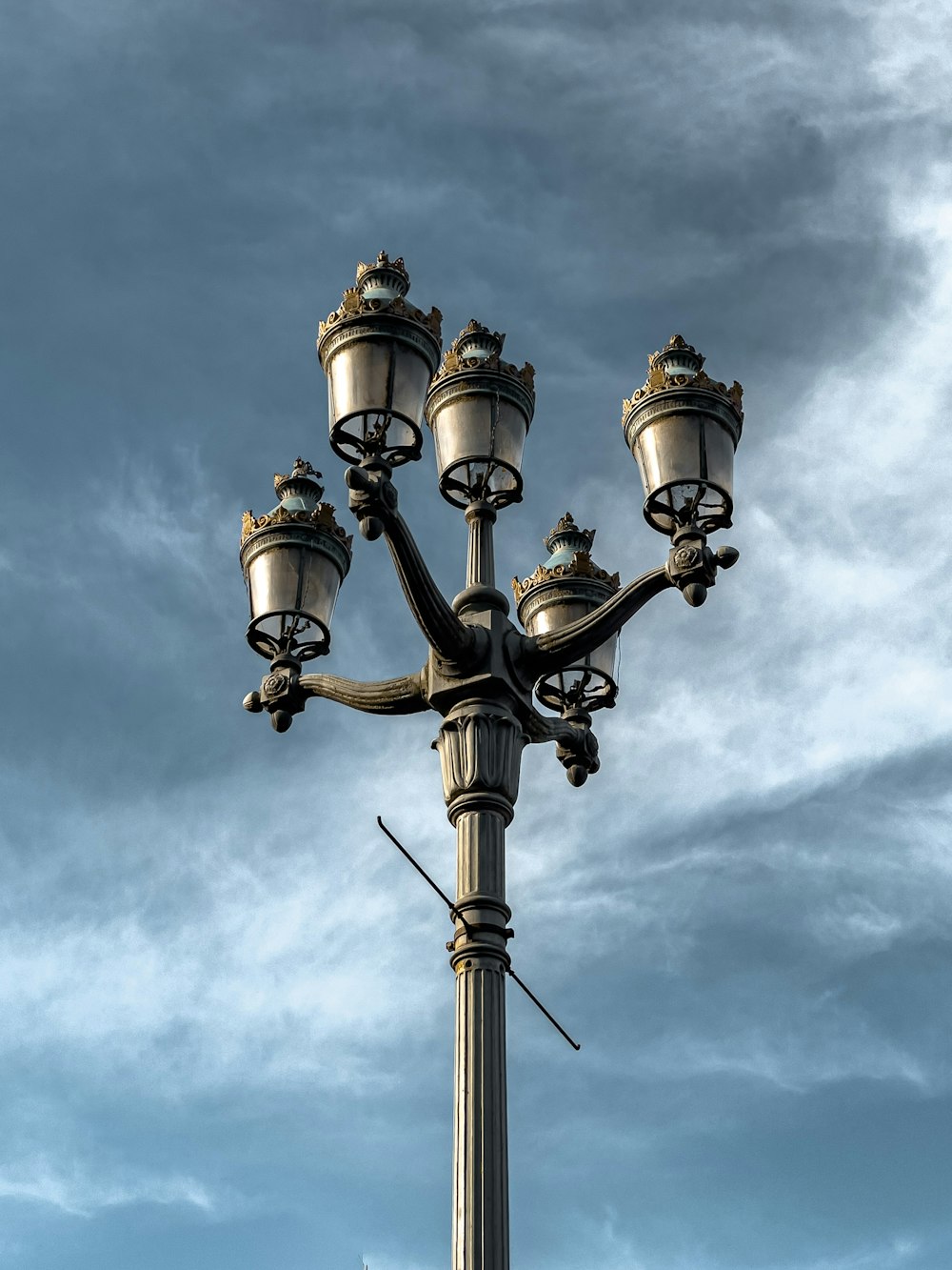 a street light with a blue sky in the background