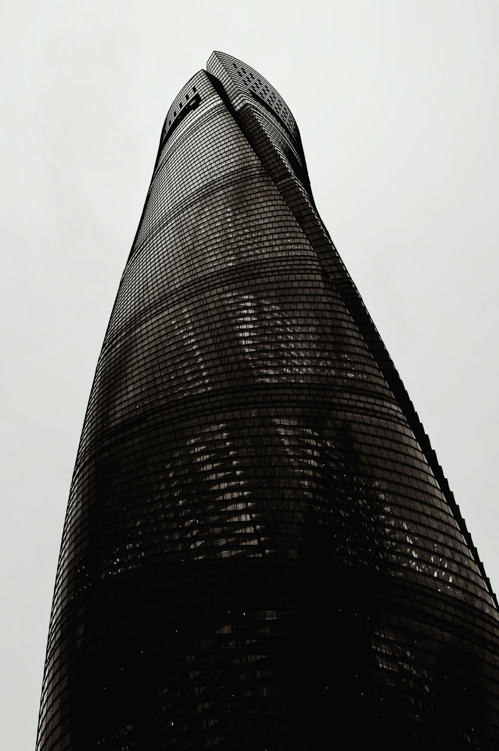 a black and white photo of a tall building