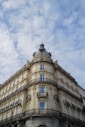 a tall building with a clock on the top of it