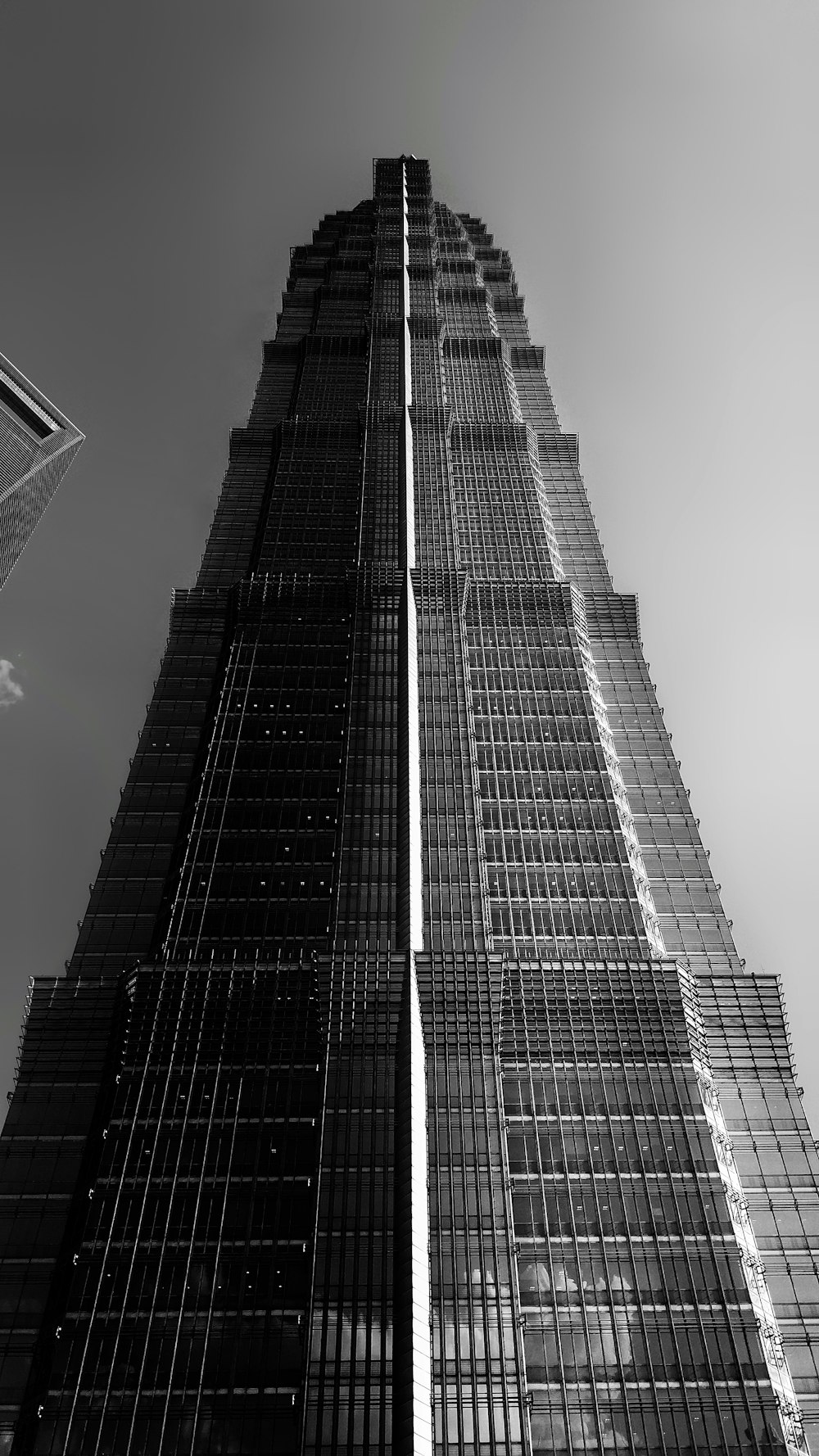 a black and white photo of a tall building