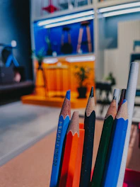 a group of pencils sitting next to each other on a table