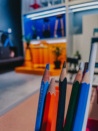 a group of pencils sitting next to each other on a table