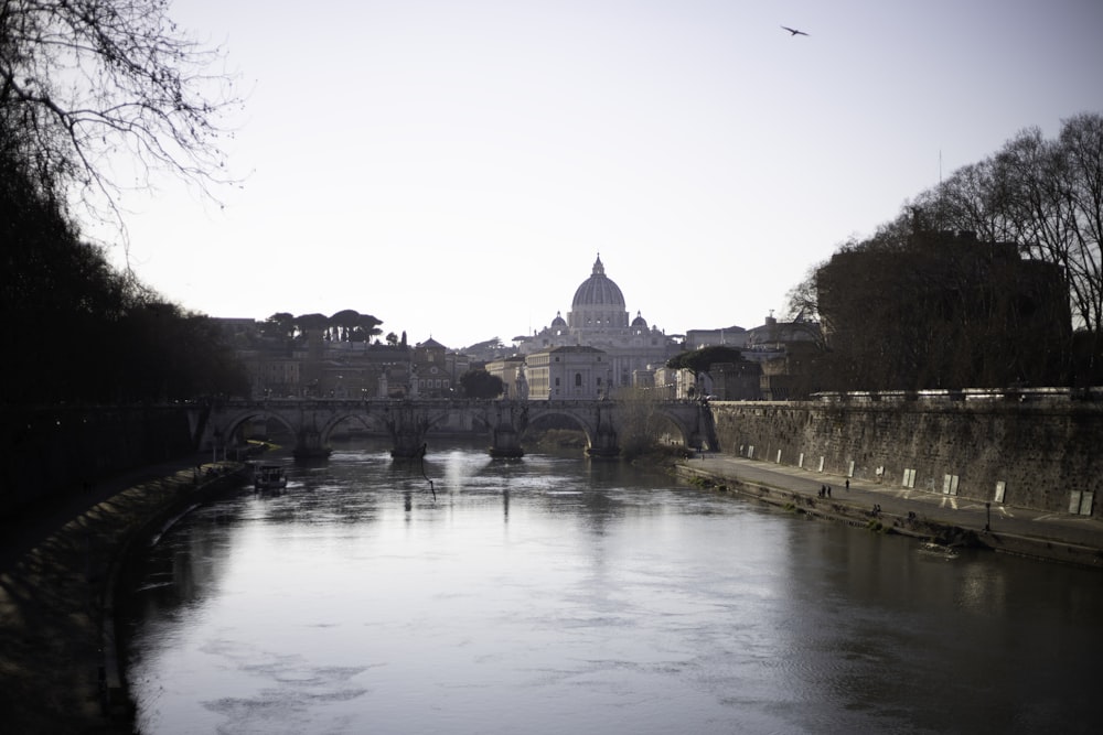 a river running through a city next to a bridge