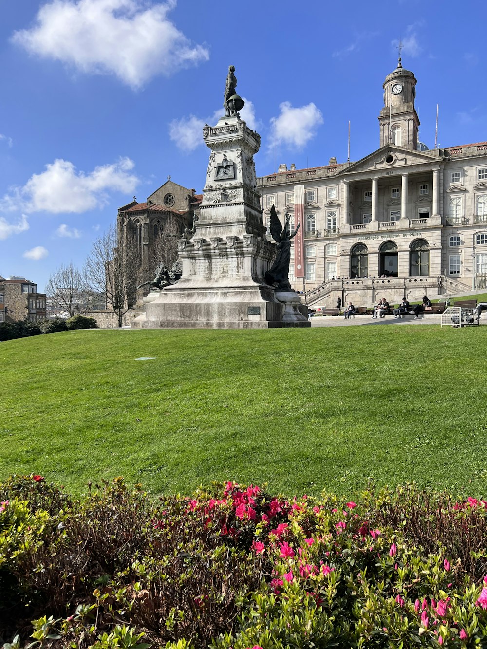 a large building with a statue in front of it