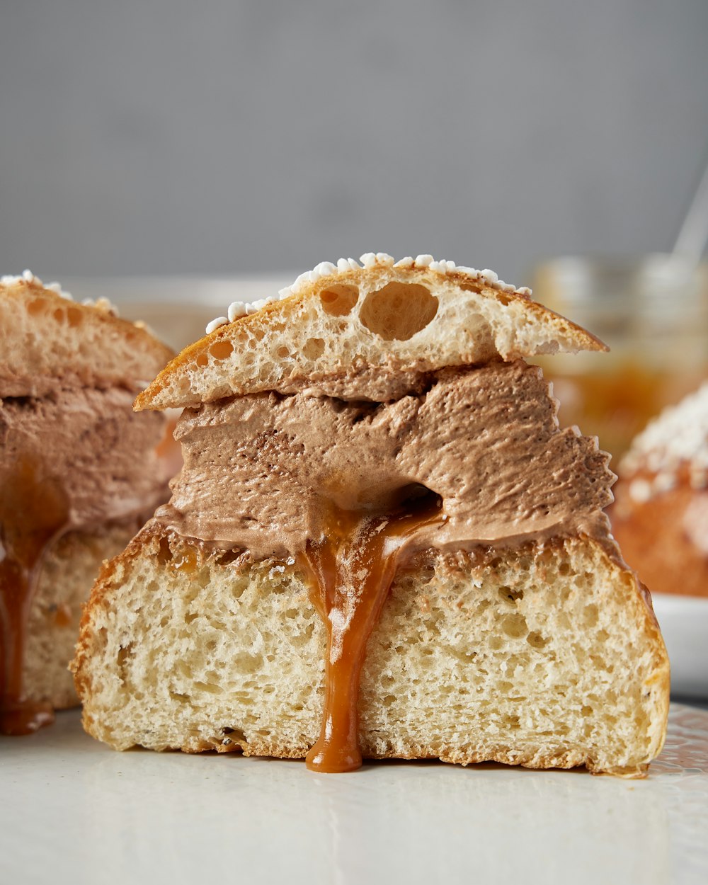 a close up of a piece of bread with chocolate frosting