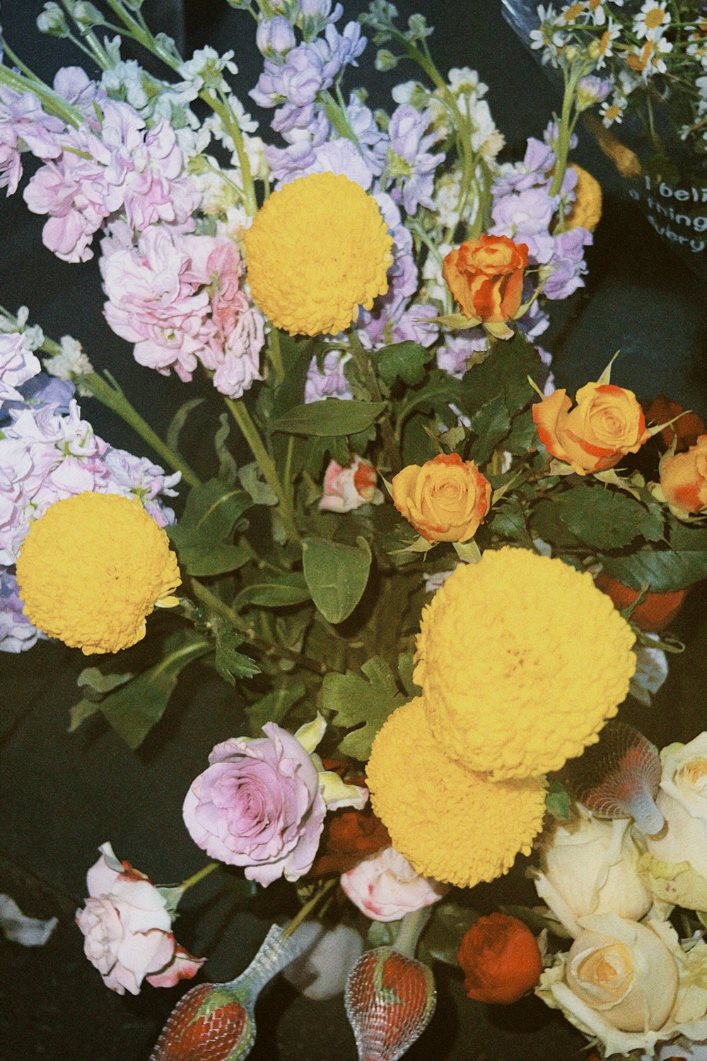 a bunch of flowers that are sitting on a table