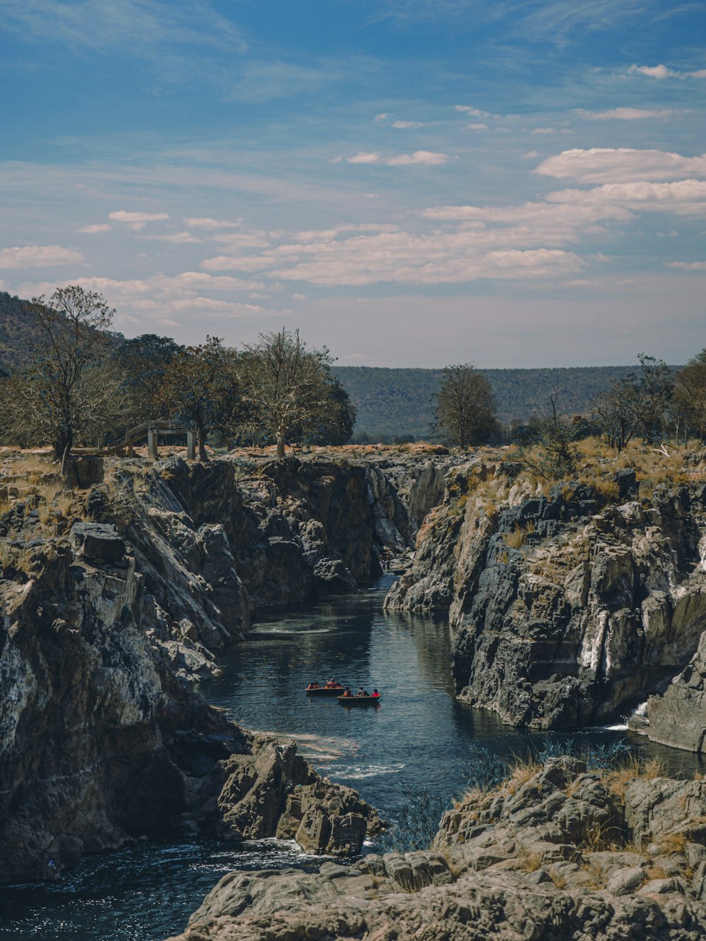 a group of people in a boat on a river