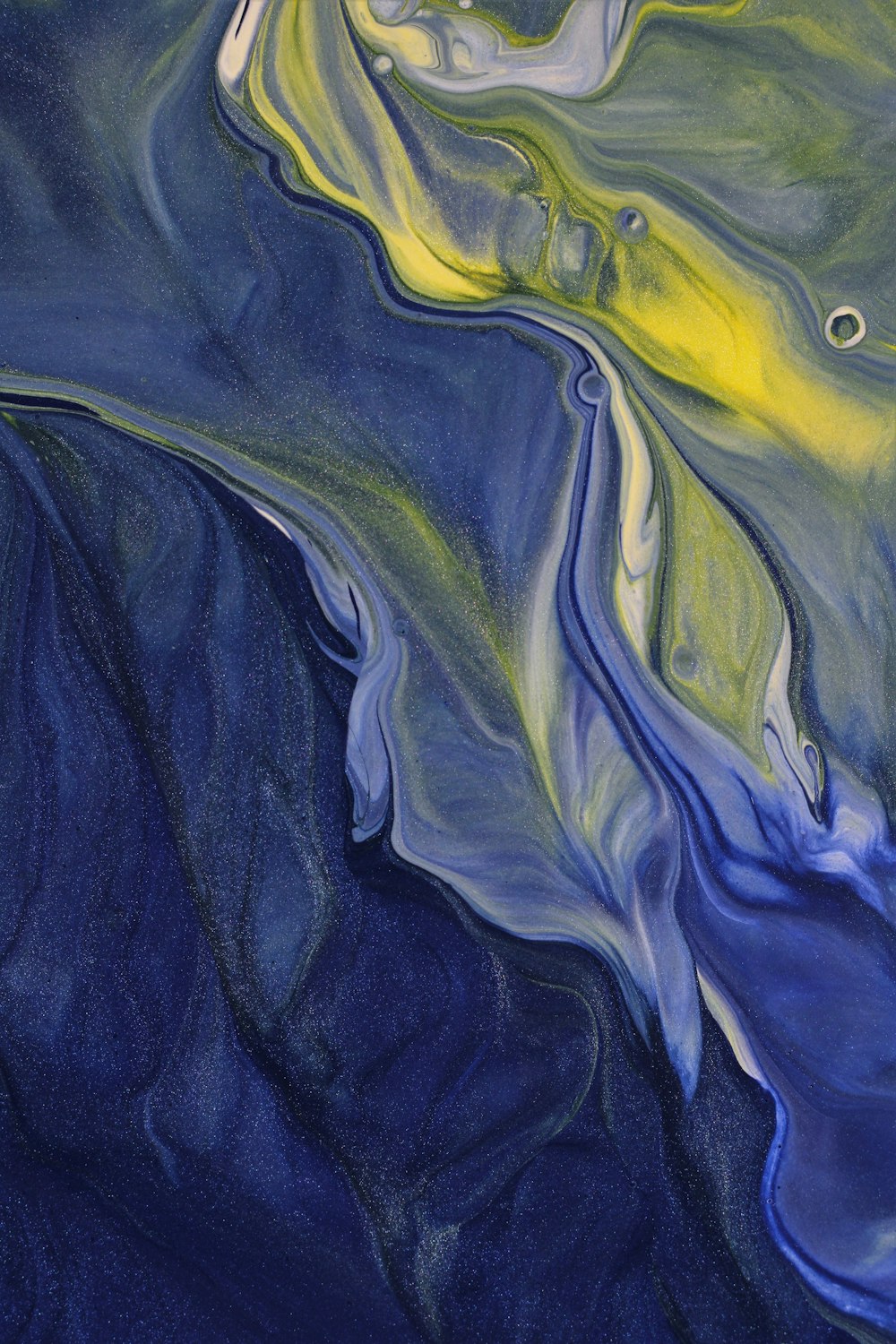 a painting of a blue and yellow liquid