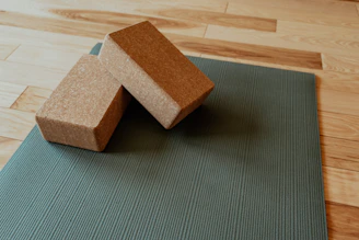 a yoga mat with two blocks on top of it