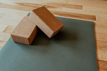 a yoga mat with two blocks on top of it